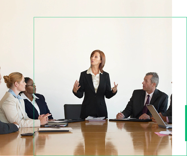 A group of people sitting around a table.