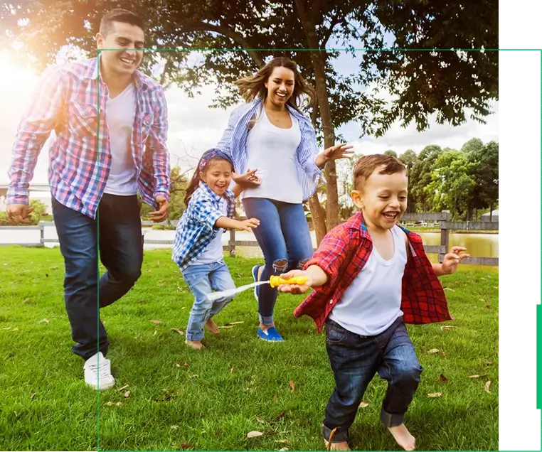 A family playing frisbee in the park